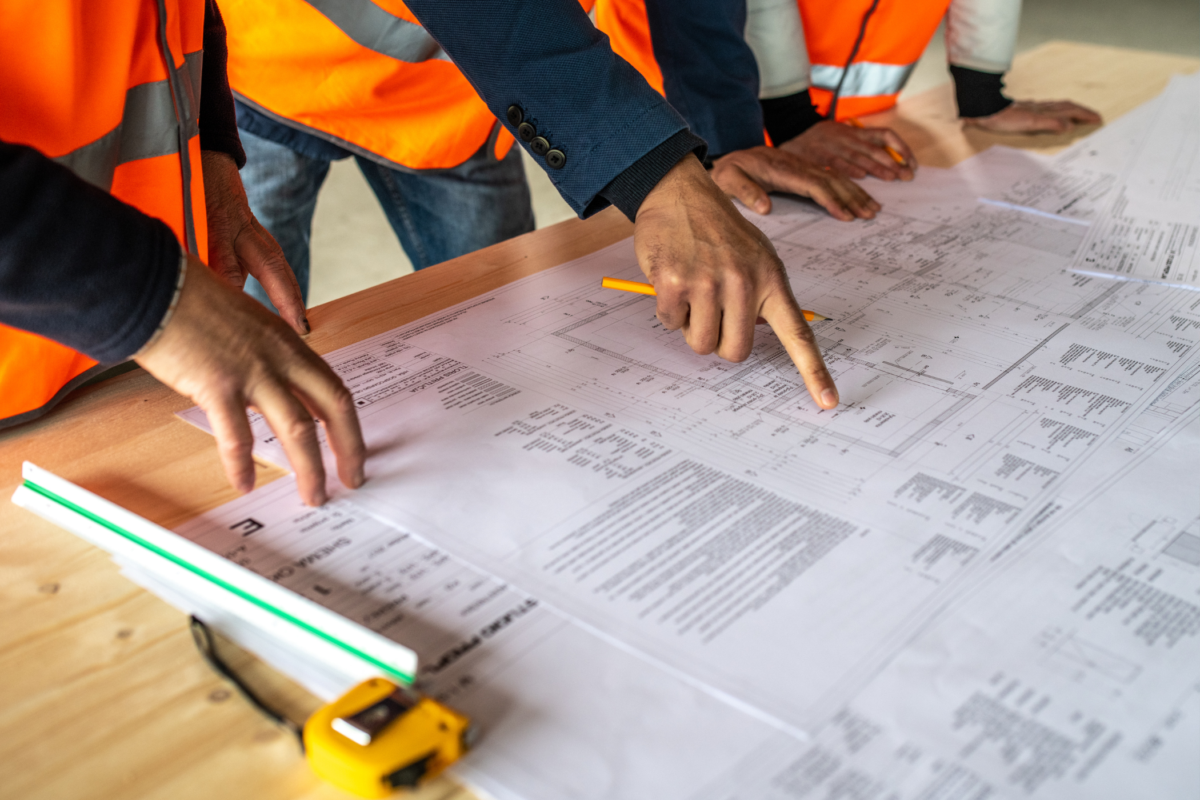 Construction workers reviewing plan