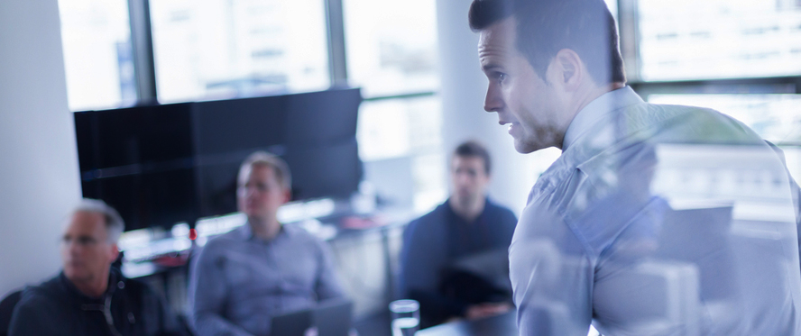 Man presenting in a conference room