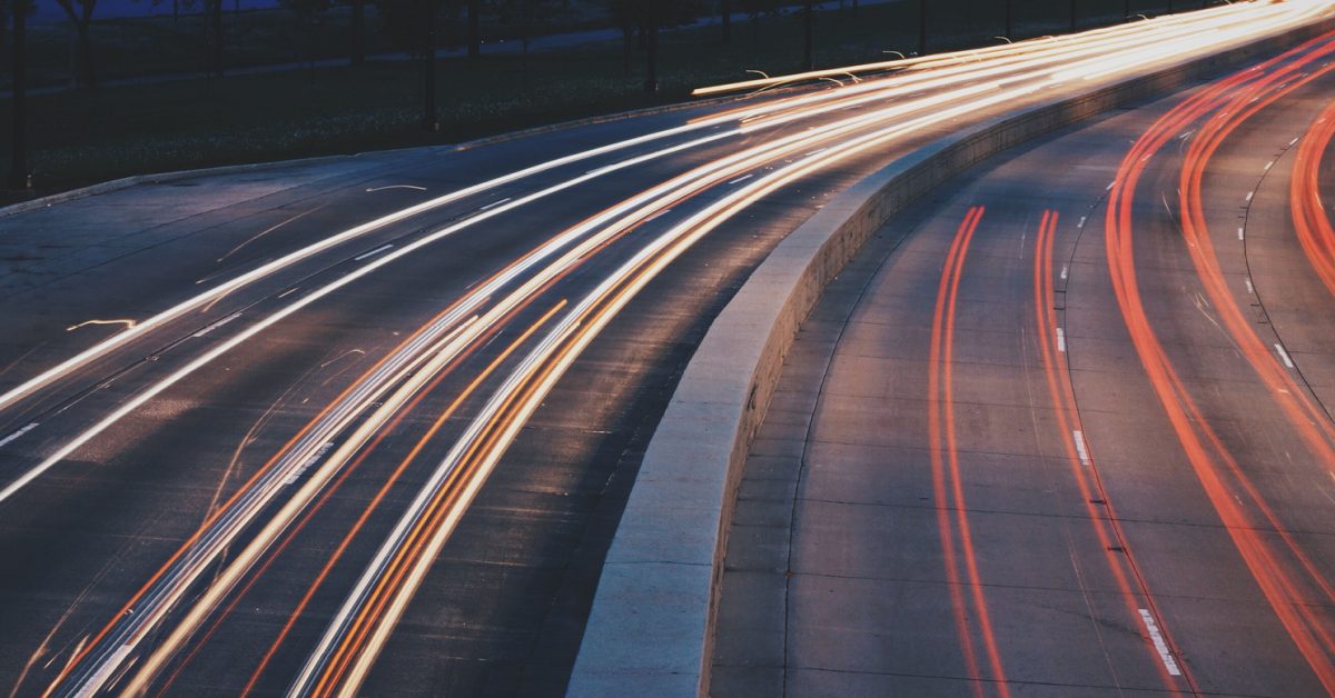 Long shutter image of high way showing the passing of car lights