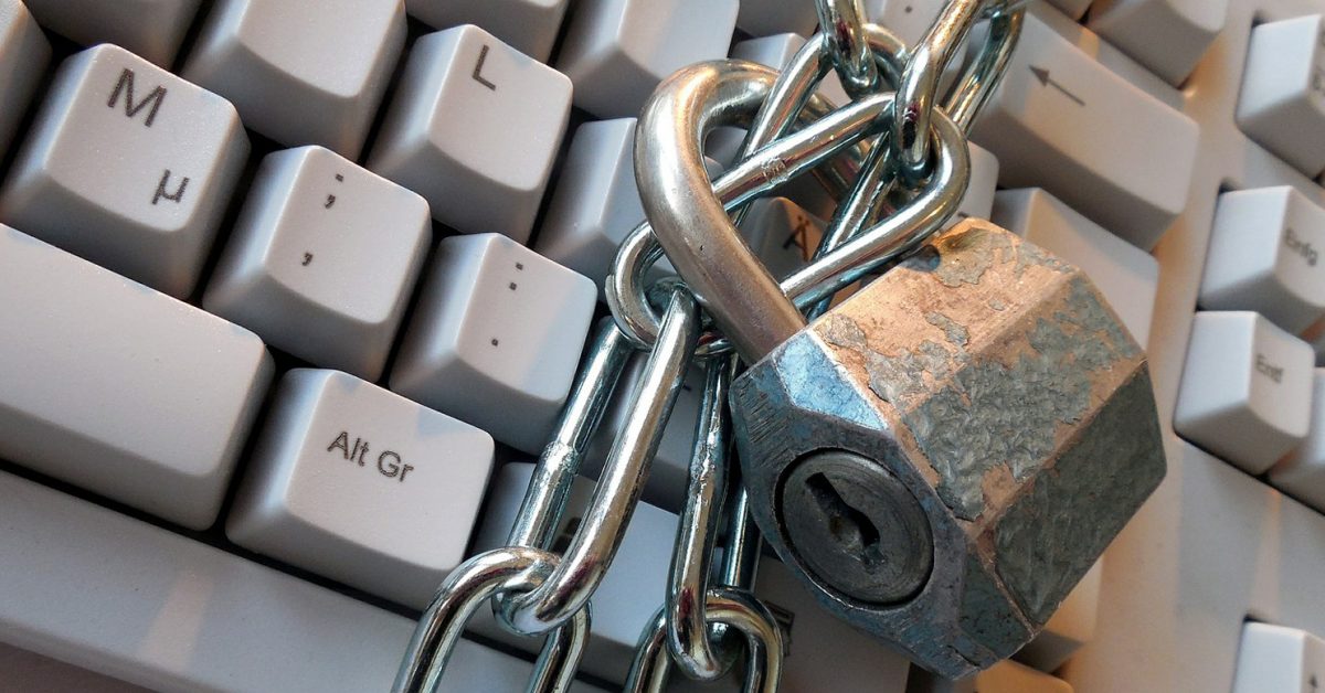 Padlock and chain around a computer keyboard