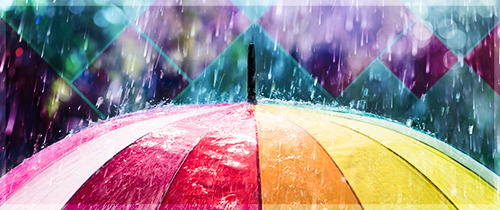 Closeup of top of an umbrella with raindrops falling