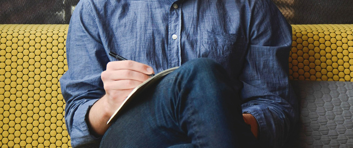 Man sitting and writing