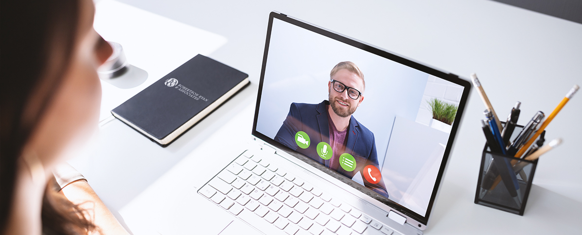 Woman having a video chat with man on laptop