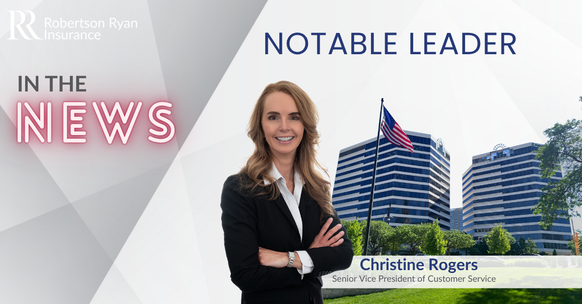 In the News Text and Christine Rogers in front of corporate office in Milwaukee