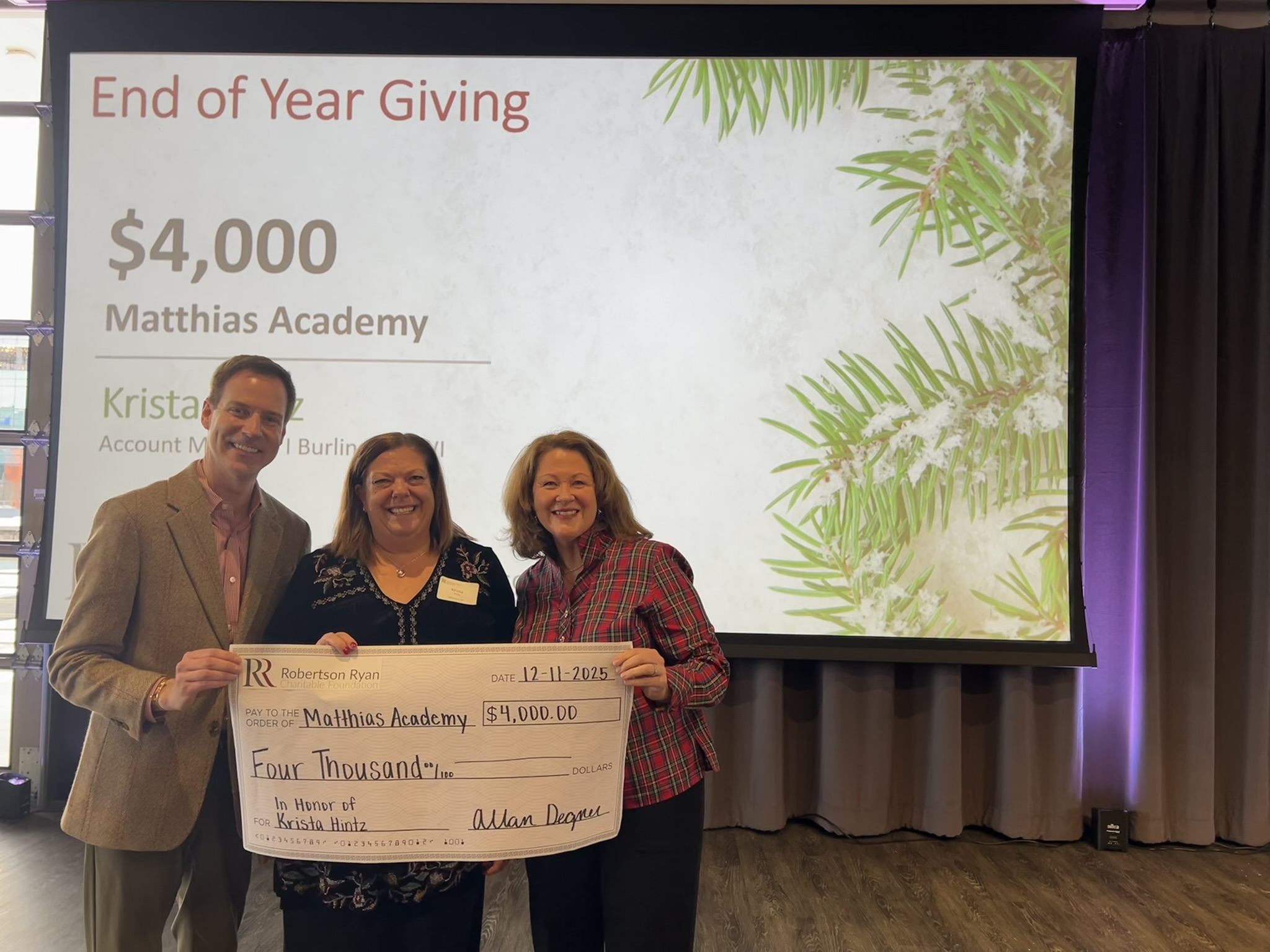 Allan Degner and Tracey Fricker Awarding Kritsa Hitz a Check